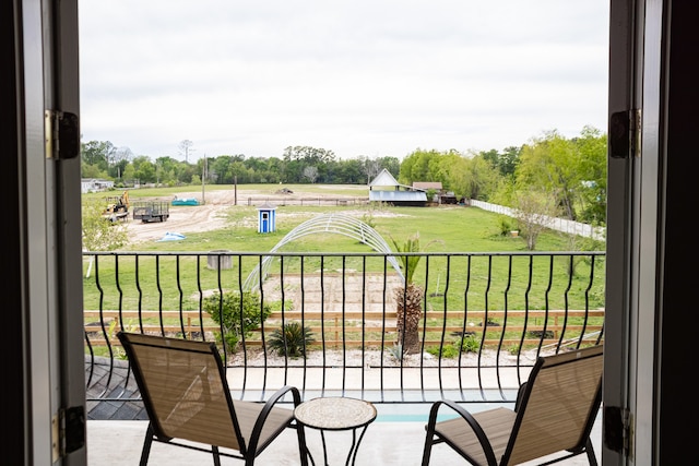 balcony featuring a swimming pool