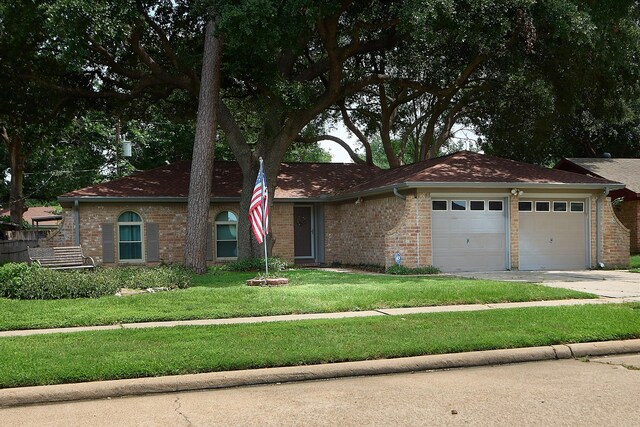 15830 Whipple Tree Dr, Houston, TX 77070 - ranch-style house with an attached garage, a front lawn, concrete driveway, and brick siding