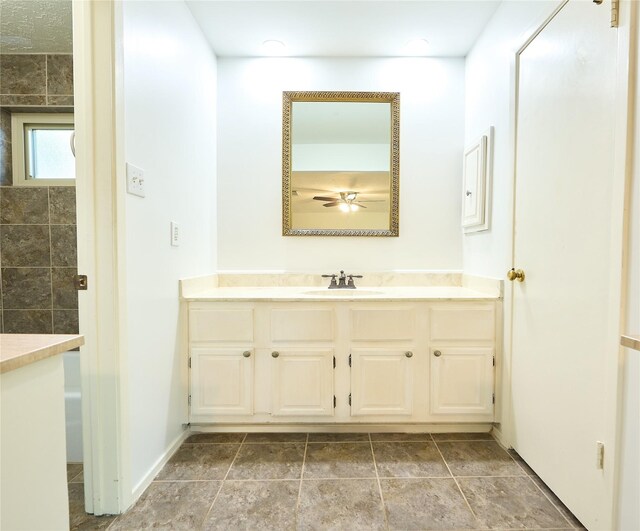 15830 Whipple Tree Dr, Houston, TX 77070 - bathroom with ceiling fan, vanity, and baseboards