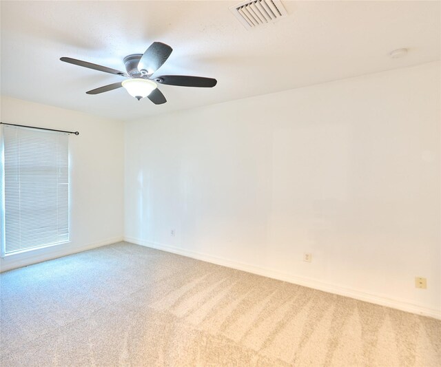 15830 Whipple Tree Dr, Houston, TX 77070 - empty room featuring light colored carpet, a smoke detector, baseboards, and a ceiling fan