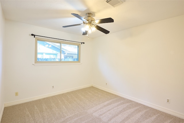 empty room with ceiling fan and carpet flooring