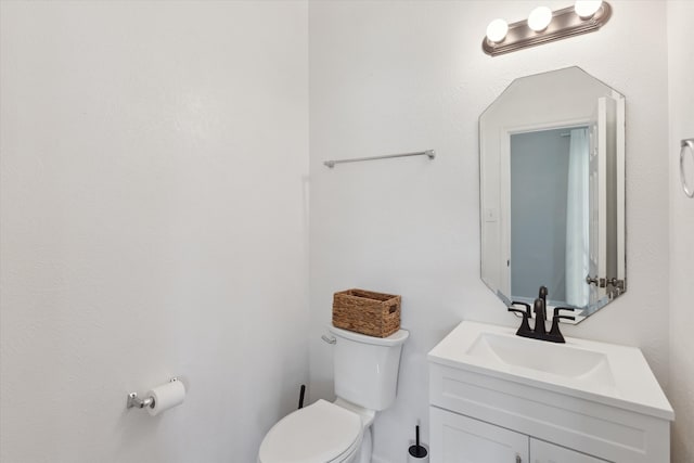 bathroom with oversized vanity and toilet