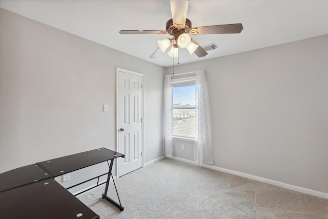 unfurnished bedroom featuring ceiling fan and carpet floors