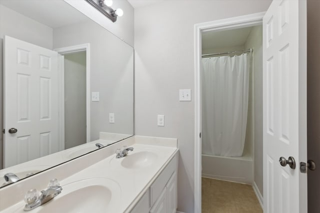 bathroom with shower / bath combination with curtain, dual bowl vanity, and tile floors