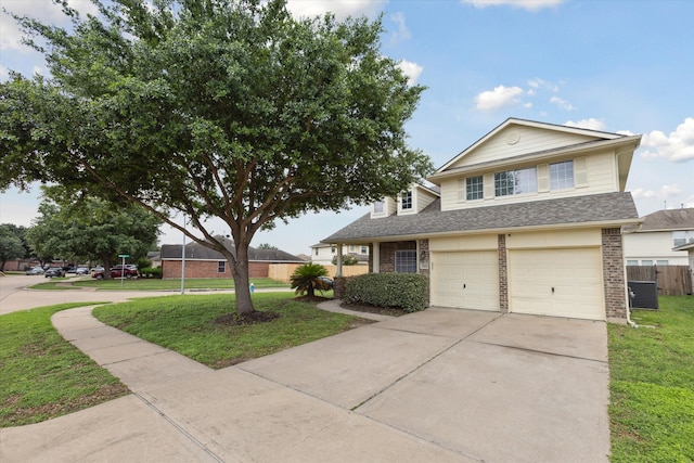 view of front of property with a front yard and a garage