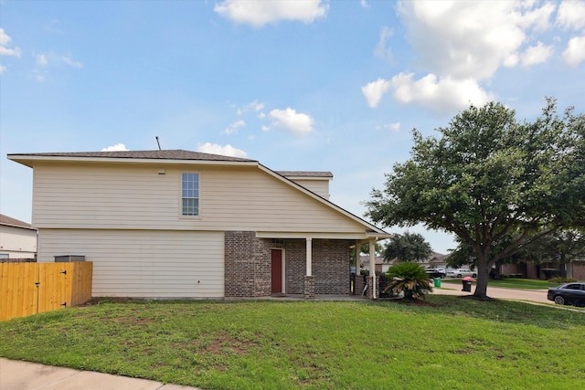 view of property exterior with a lawn