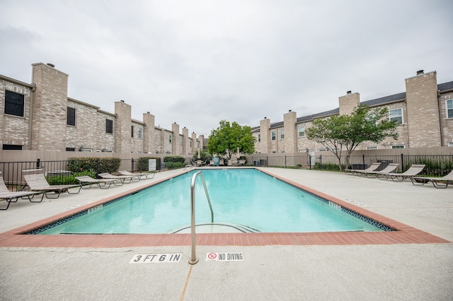 view of swimming pool with a patio area