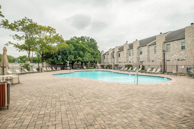 view of swimming pool with a patio