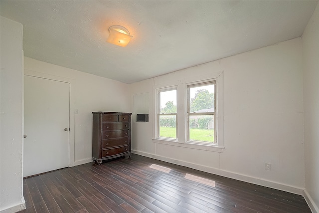 empty room featuring dark hardwood / wood-style floors