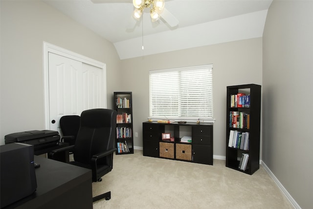 office area featuring light colored carpet, lofted ceiling, and ceiling fan