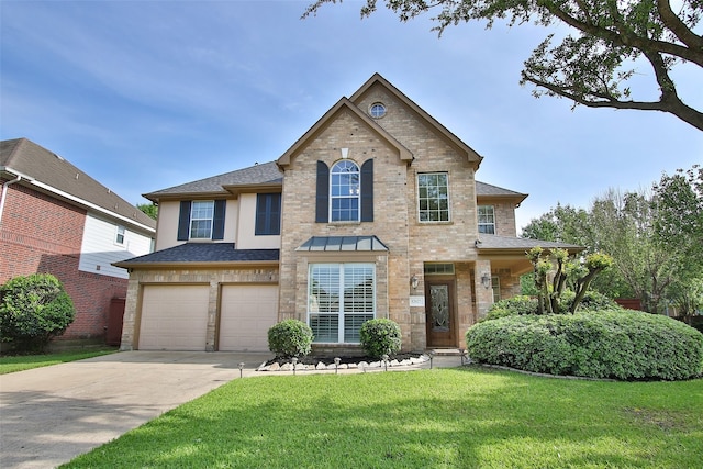 view of front of home featuring a garage and a front lawn