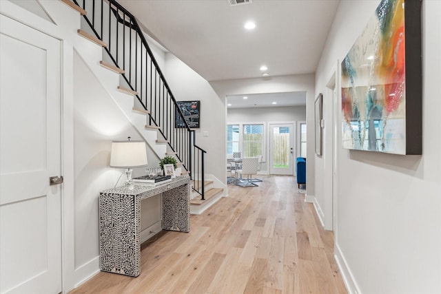 interior space with stairs, baseboards, light wood-style flooring, and recessed lighting