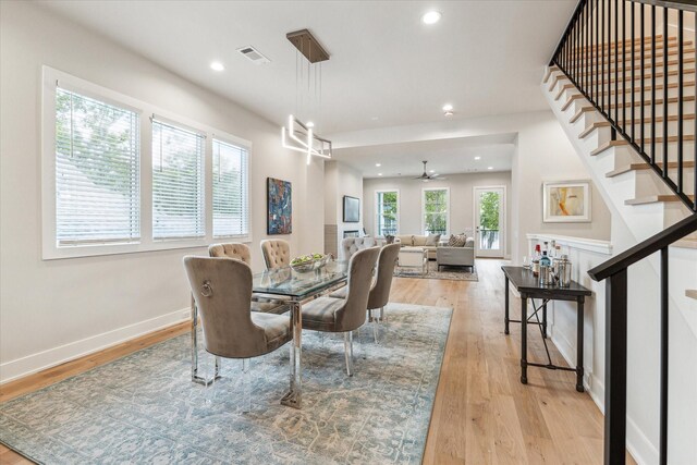 dining area featuring stairs, light wood-type flooring, visible vents, and recessed lighting