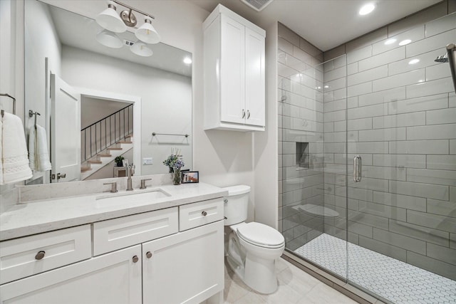 bathroom with toilet, tile patterned flooring, vanity, a shower stall, and recessed lighting