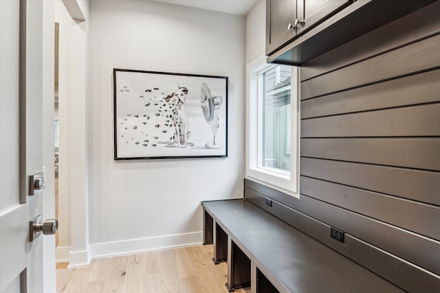 mudroom with baseboards and light wood finished floors