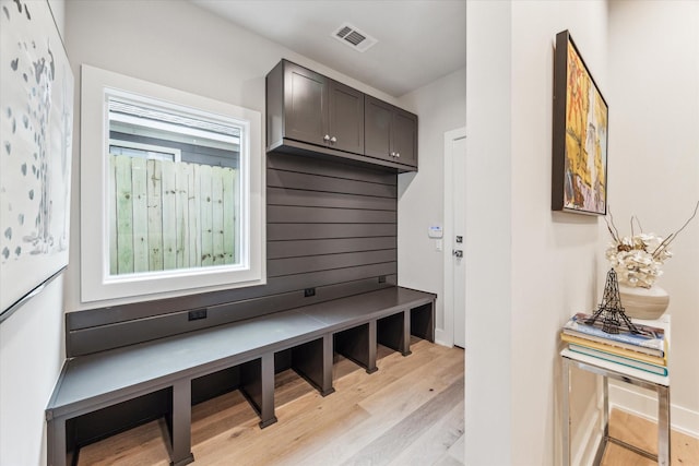 mudroom with visible vents and light wood finished floors