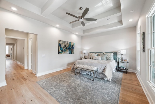 bedroom with light wood-style floors and baseboards