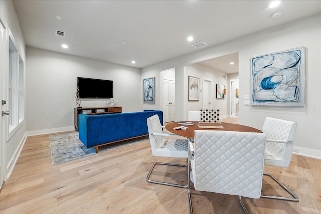 dining room featuring baseboards, recessed lighting, visible vents, and light wood-style floors