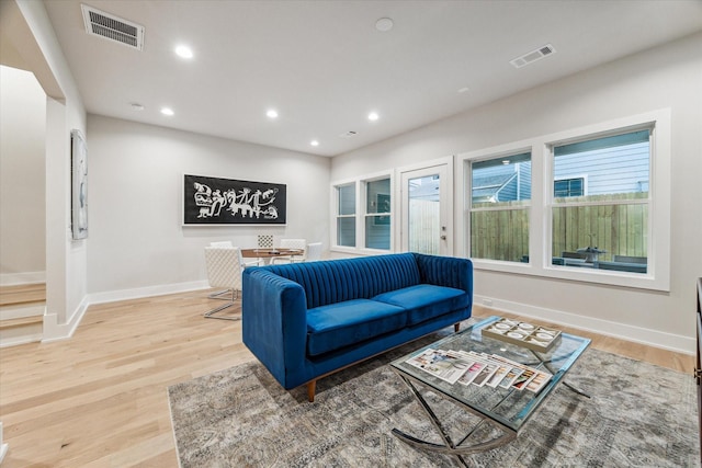 living room featuring recessed lighting, visible vents, and light wood-style floors