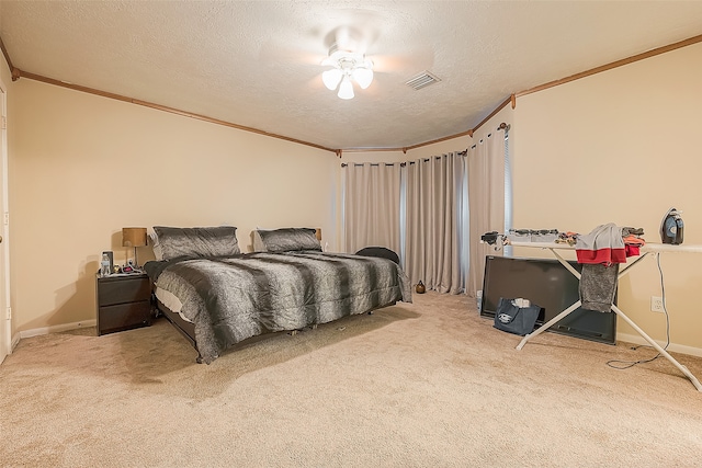 carpeted bedroom featuring crown molding, ceiling fan, and a textured ceiling