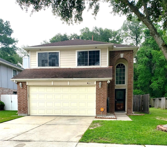 view of front of house featuring a garage and a front yard