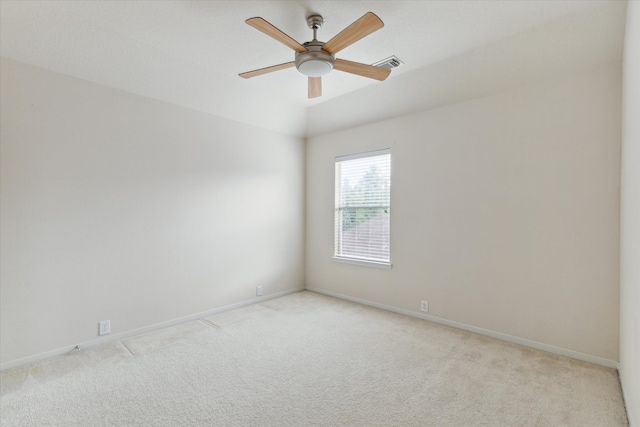 carpeted empty room with ceiling fan