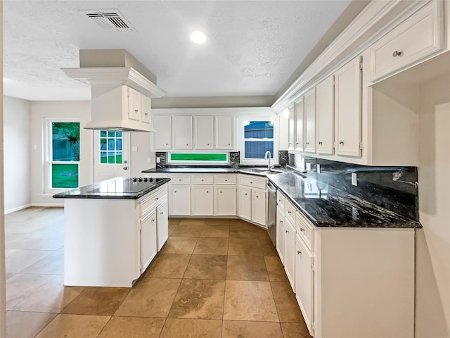 kitchen featuring light tile floors, appliances with stainless steel finishes, white cabinetry, and sink