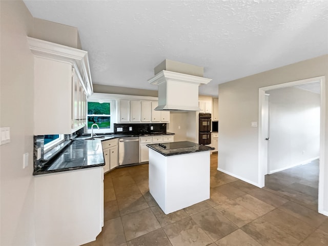 kitchen with a center island, double oven, sink, stainless steel dishwasher, and tile floors