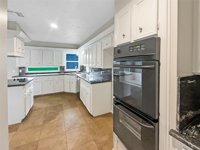 kitchen featuring light tile floors, white cabinets, dishwasher, gas stovetop, and black double oven