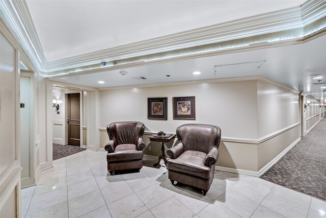 living area with carpet flooring and crown molding