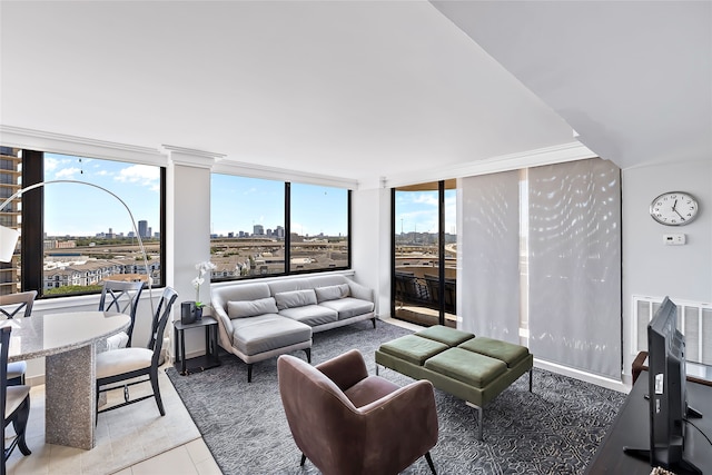 living room featuring floor to ceiling windows, a wealth of natural light, and tile flooring