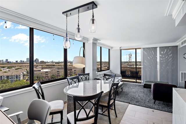 dining space featuring plenty of natural light and light tile floors