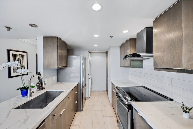 kitchen featuring wall chimney exhaust hood, electric stove, light tile floors, sink, and backsplash