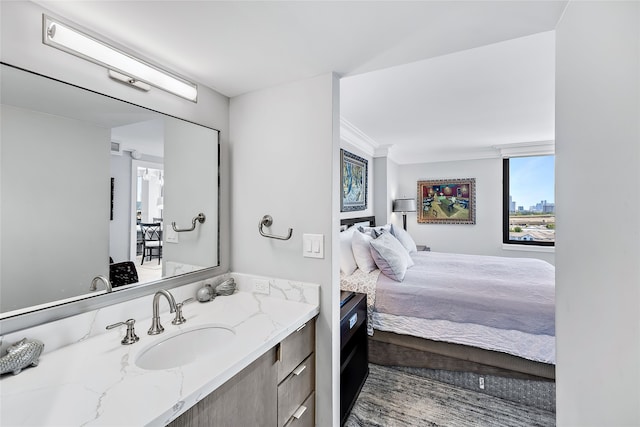 bathroom with vanity and crown molding