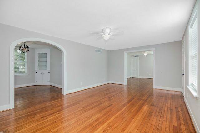 unfurnished room featuring ceiling fan and light wood-type flooring