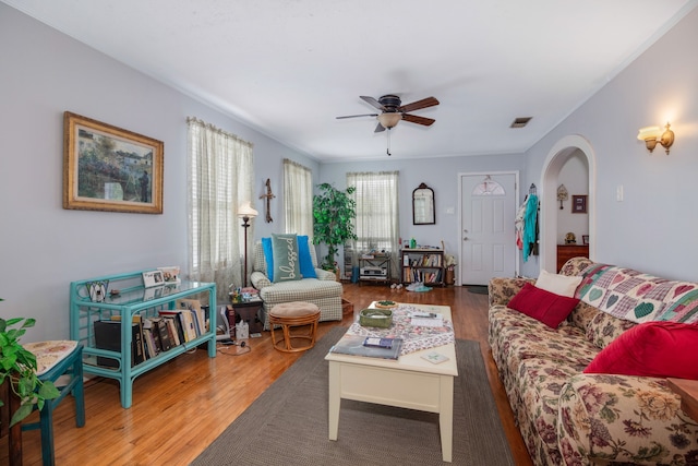 living room with ceiling fan and hardwood / wood-style flooring