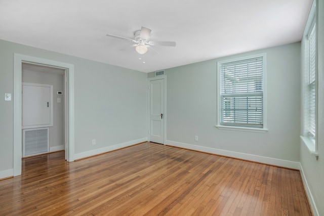 unfurnished room featuring ceiling fan and hardwood / wood-style flooring