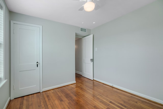 unfurnished bedroom with hardwood / wood-style floors and ceiling fan