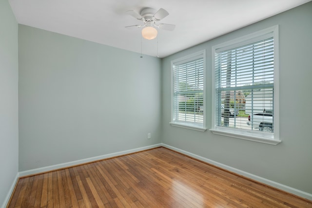 empty room with wood-type flooring and ceiling fan