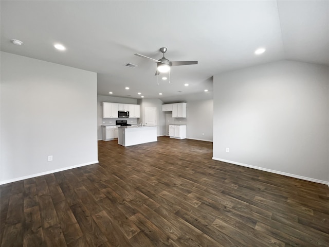 unfurnished living room with dark hardwood / wood-style flooring, ceiling fan, and lofted ceiling