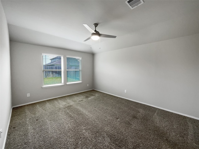 empty room with carpet floors and ceiling fan