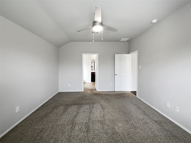 carpeted spare room featuring ceiling fan and lofted ceiling