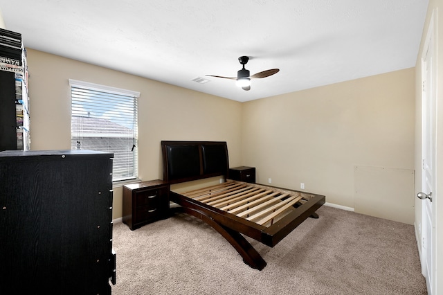 bedroom featuring light carpet and ceiling fan