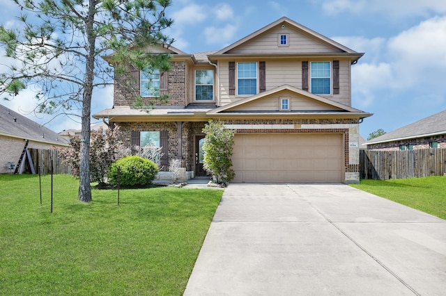 view of front of home with a front yard and a garage