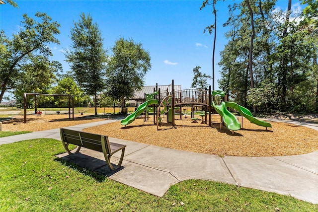 community jungle gym featuring a lawn