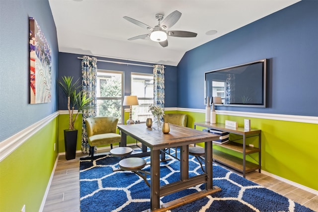 sitting room with wood tiled floor, vaulted ceiling, baseboards, and ceiling fan