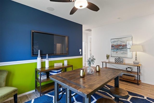 dining area featuring wood finish floors, visible vents, and baseboards