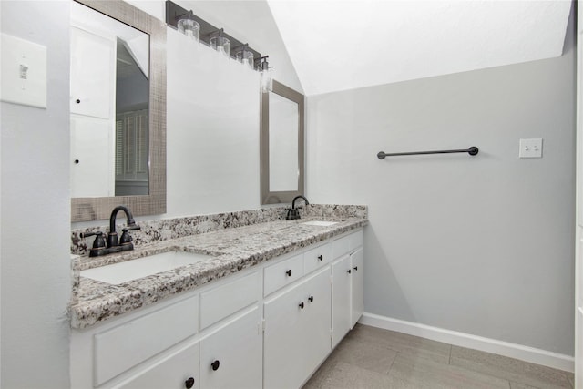 427 Pebblebrook Dr, El Lago, TX 77586 - bathroom featuring tile flooring, lofted ceiling, and dual bowl vanity
