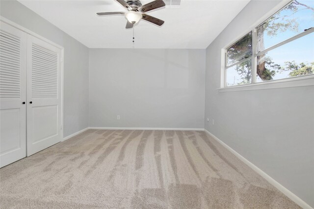 427 Pebblebrook Dr, El Lago, TX 77586 - unfurnished bedroom featuring a closet, ceiling fan, and carpet floors