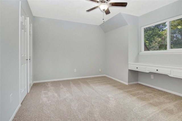 427 Pebblebrook Dr, El Lago, TX 77586 - empty room featuring ceiling fan, carpet floors, and lofted ceiling